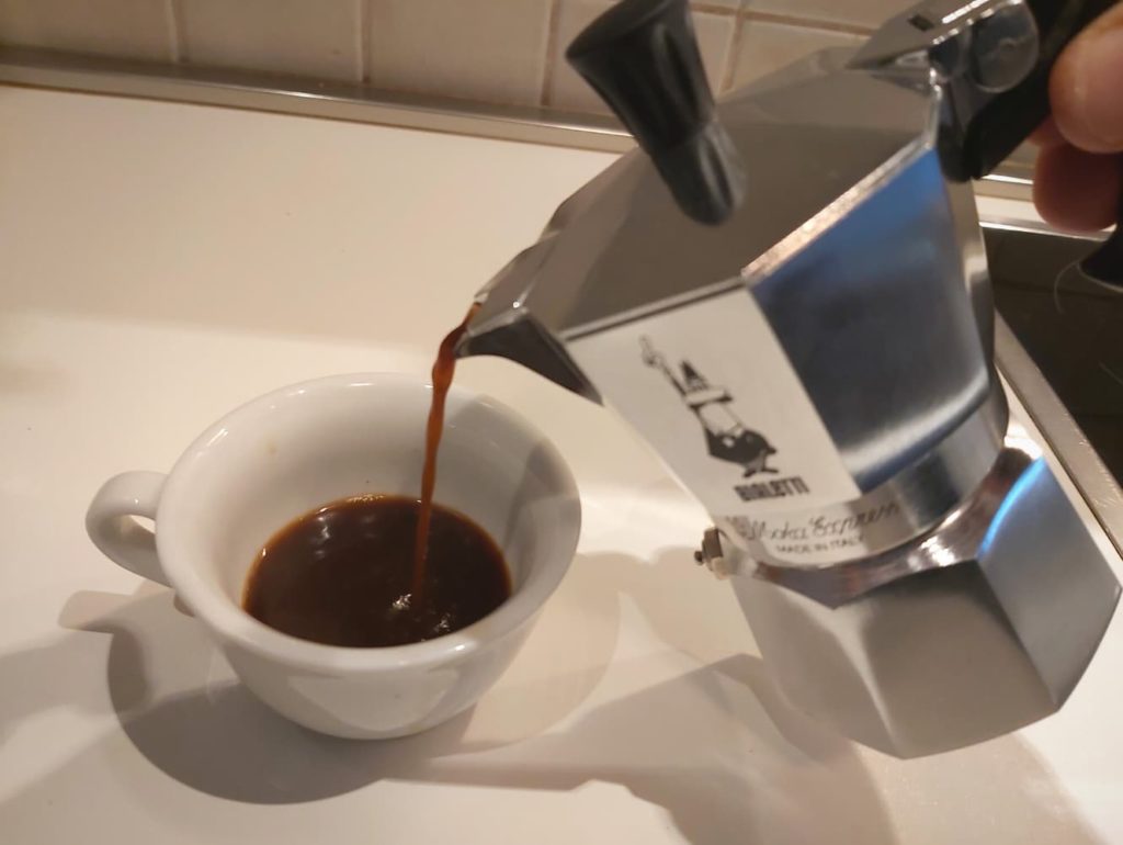 pouring moka pot coffee - Coffee Paradiso