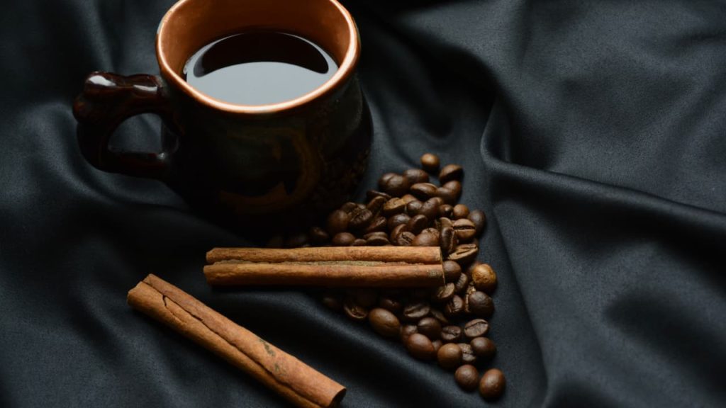 coffee cup and cinnamon - Coffee Paradiso